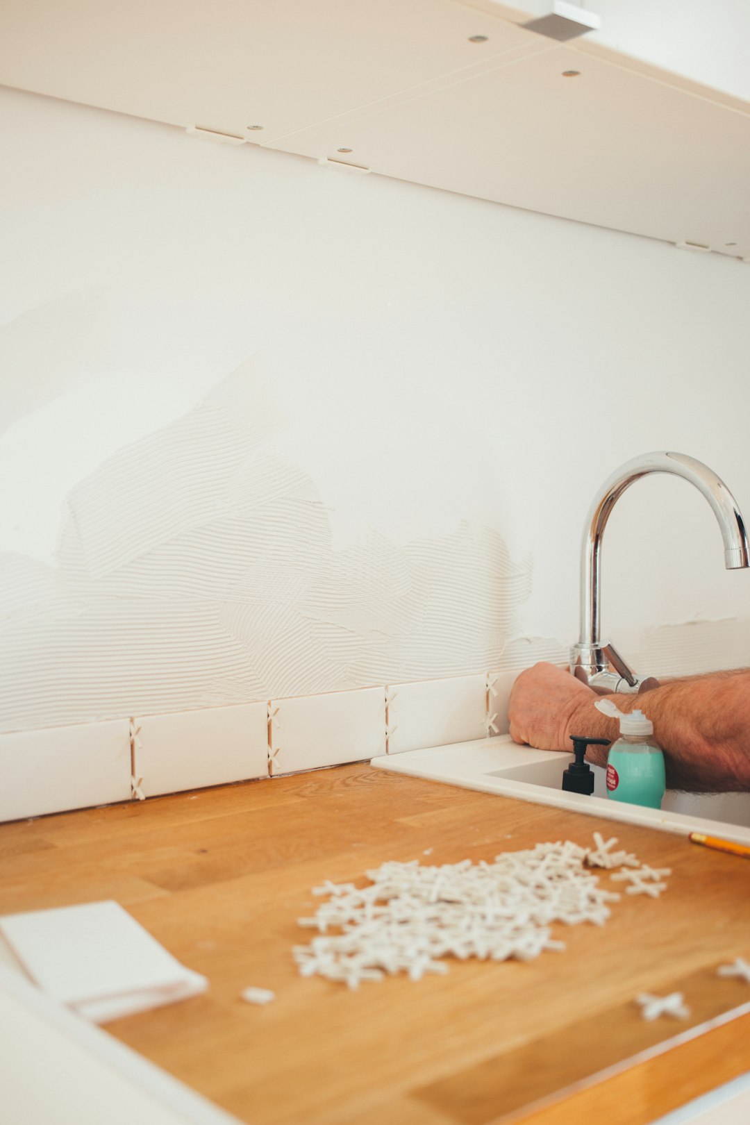 Professional cabinet installation showing precision carpentry work and skilled craftsmanship